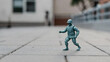 © pippo - Miniature Plastic Toy Soldier Fighting Pose on Urban Pavement with Tilt-Shift Effect Conceptual Photography