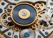© Alpha - Intricate watch mechanism with gold and silver gears