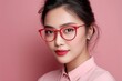 © tynza - Asian woman wearing fashionable eyeglasses, clean skin tones, soft pastel background, minimal portrait