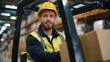 © Maksym - Medium shot of a forklift operator lifting cardboard boxes, concentrated expression on face, safety vest and hard hat illuminated by warehouse lighting, rows of pallets and contain