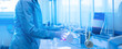 © Parilov - Laboratory technician measuring liquid with burette at lab bench