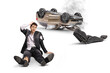 © Ljupco Smokovski - Shocked businessman in a torn suit sitting on the floor after a car accident