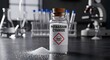 © Recon - A bottle of potassium cyanide placed on a laboratory bench with other lab equipment.