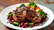 © mila103 - Grilled steak medallions plated with beans and broccoli.