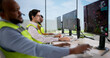 © Andrey Popov - Diverse Air Traffic Control Team Monitors Flights Using Computers In Tower