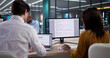 © Andrey Popov - Diverse Compliance Team Reviews Confidential Patient Data On Laptops