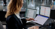 © Andrey Popov - Woman Working At Office Desk, Using Online Banking App