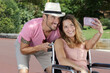 © auremar - happy young couple in wheelchair doing a selfie