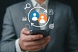 © PNG World - Business person holding a smartphone with digital icons for customer relationship management