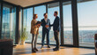 © Дмитрий Лазебный - Real estate agent showing clients a modern apartment interior with tablet displaying a floor plan and a handshake during a property tour