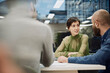 © Westend61 - Business meeting in a modern London office during the evening