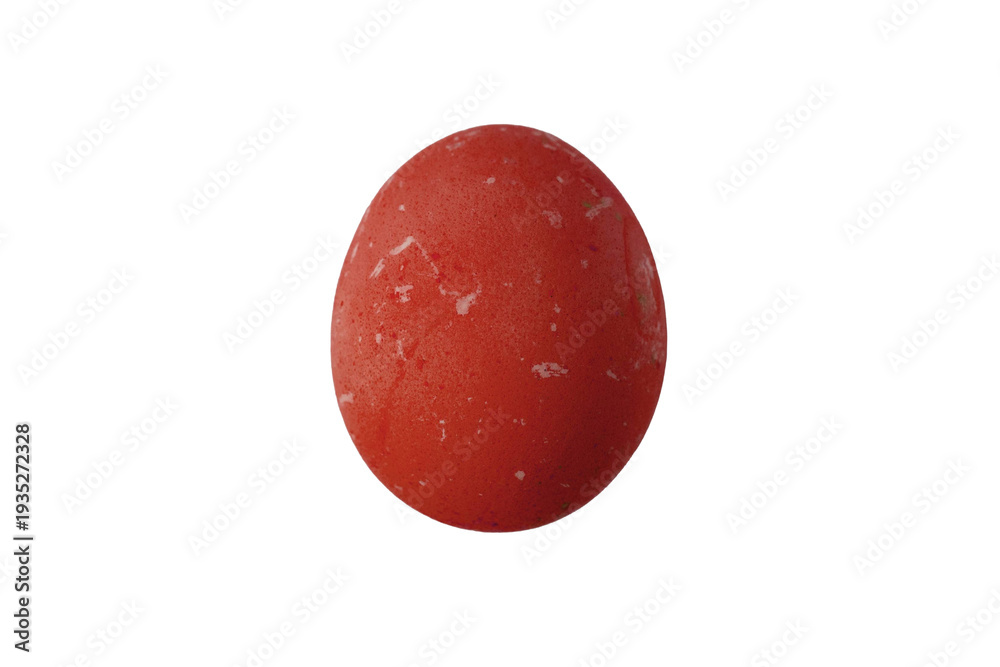 Red egg sits on a white background showing texture and color details in ...
