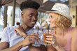 © auremar - friends having a drinki outdoors