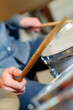 © auremar - closeup of drummer holding drumsticks over drums