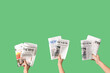 © Pixel-Shot - Women with newspapers on green background