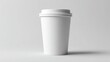 © muhammad - A plain white disposable coffee cup with a double-lid sits on a light gray background