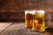 © vectorizer88 - Rustic Wood Countertop with Two Glass Beer Steins at an Angle