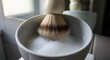 © Deep Stock - Traditional Shaving Brush Creating Rich Lather in Shaving Bowl , Classic Wet Shaving Grooming Ritual for Men with Luxury Barber Tools and Cream Foam for Smooth Beard Shave