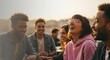 © gankevstock - Diverse group of friends laughing together outdoors at sunset