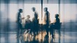 © Oleh - Abstract motion blur creating silhouettes of diverse business professionals actively discussing ideas during a dynamic corporate meeting in a bright, contemporary office setting