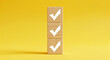 © Sarah - Vertical wooden blocks with white checkmarks on yellow perfect for task management goal tracking and business approval