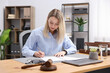 © New Africa - Notary working at wooden desk in office
