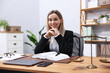 © New Africa - Portrait of notary at wooden desk in office