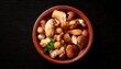 © RizalAziz - Bowl of Assorted Mushrooms on a Dark Background.