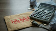 © MP-AI - Urgent final notice letter risk financial trouble on table with calculator paper bill debt payment warning overdue account stress concept focus