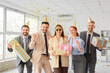 © Pixel-Shot - Group of funny business people with Birthday gifts in office