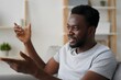 © Color Tone - Man explaining gesturing african american home communication lifestyle