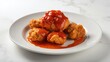 © VolumeThings - Crispy Fried chicken in a white plate with tomato sauce on white background table