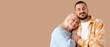 © Pixel-Shot - Young man with his mother hugging on beige background