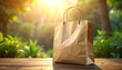 © Aditya - Brown paper shopping bag on a wooden table, bathed in warm natural sunlight filtering through lush green foliage, symbolizing eco-friendly choices and sustainable living