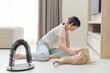 © Jirawatfoto - Cheerful young asian woman playing with friendly pet cat on living room floor at home promoting positive mental health and overall wellness through joyful bonding and peaceful daily interaction