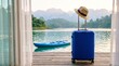 © Senja - Ready for adventure a blue suitcase and a hat await by a serene lake, hinting at a perfect getaway