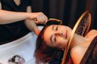 © Roman - Young woman enjoying professional head spa treatment. Japanese spa head
