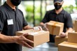 © Malika - Staff Preparing Packages in a Late Afternoon Setting with Focused Scene