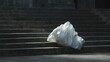 © CYBERPINK - Set of stone stairs with a large white plastic bag on the steps. the bag appears to be empty and is lying on the ground in front of the stairs.