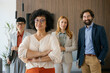 © BusinessClass by W61 - Confident business team standing together in a modern office environment