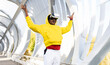 © Westend61 - Carefree sportsman using virtual reality headset while standing on walkway
