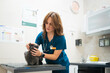 © Gonzalo Infiesta - Veterinarian checking cat during annual checkup in clinic