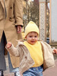 © phpetrunina14 - Toddler Taking First Steps Outdoors in Yellow Knit Hat portrait