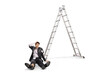 © Ljupco Smokovski - Мan in a torn suit fallen from a ladder sitting on the floor