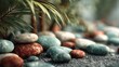 © Crocodilchik - collection of colorful pebbles in hand with soft natural lighting, calm nature background, peaceful and minimal composition