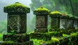 © kasmiawati - Ancient Stone Lanterns Covered in Vibrant Green Moss in a Misty Forest.