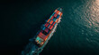© PB Studio - top down cargo ship in dark ocean water, dramatic contrast between colorful containers and deep sea, centered vessel composition, long wake line, cinematic natural lighting, minimalistic ocean