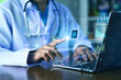 © Suriyo - Doctor Working with AI Data Analytics Interface on Laptop for Digital Healthcare System