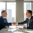© Rajesh - A professional team of smiling businessmen and businesswomen in suits shake hands while working together during a corporate meeting in an office