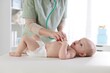 © New Africa - Doctor examining baby with stethoscope in hospital, closeup